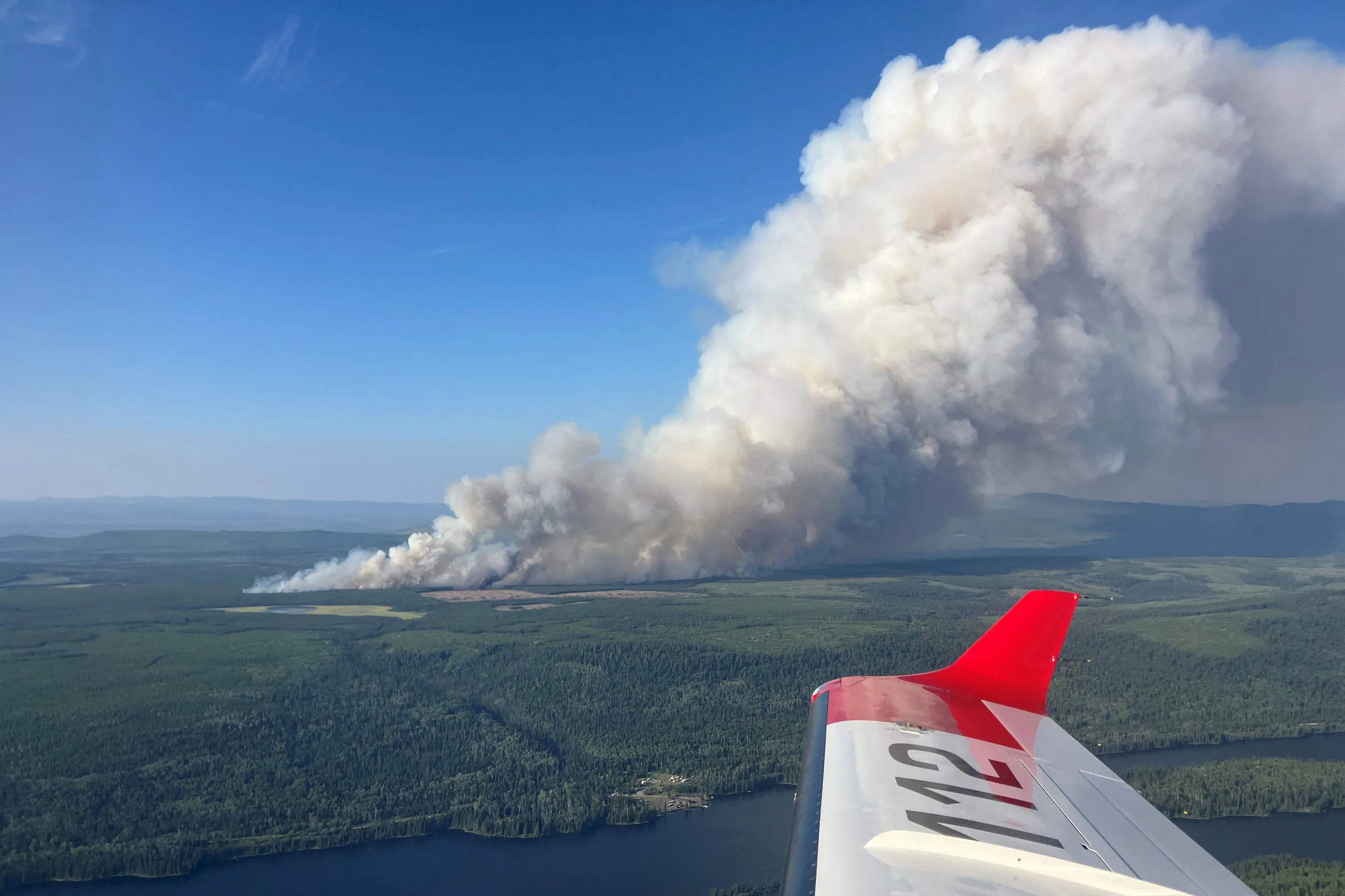 B.C. wildfires force evacuations as smoke blankets the Interior; Clinton threatened