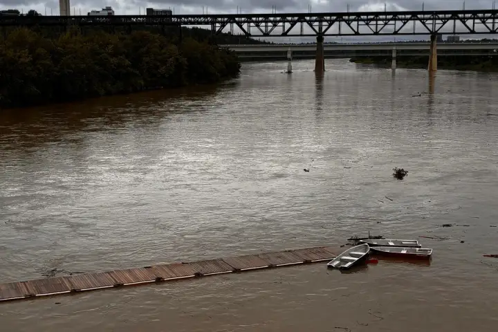 Entire dock with five boats swept down North Saskatchewan River